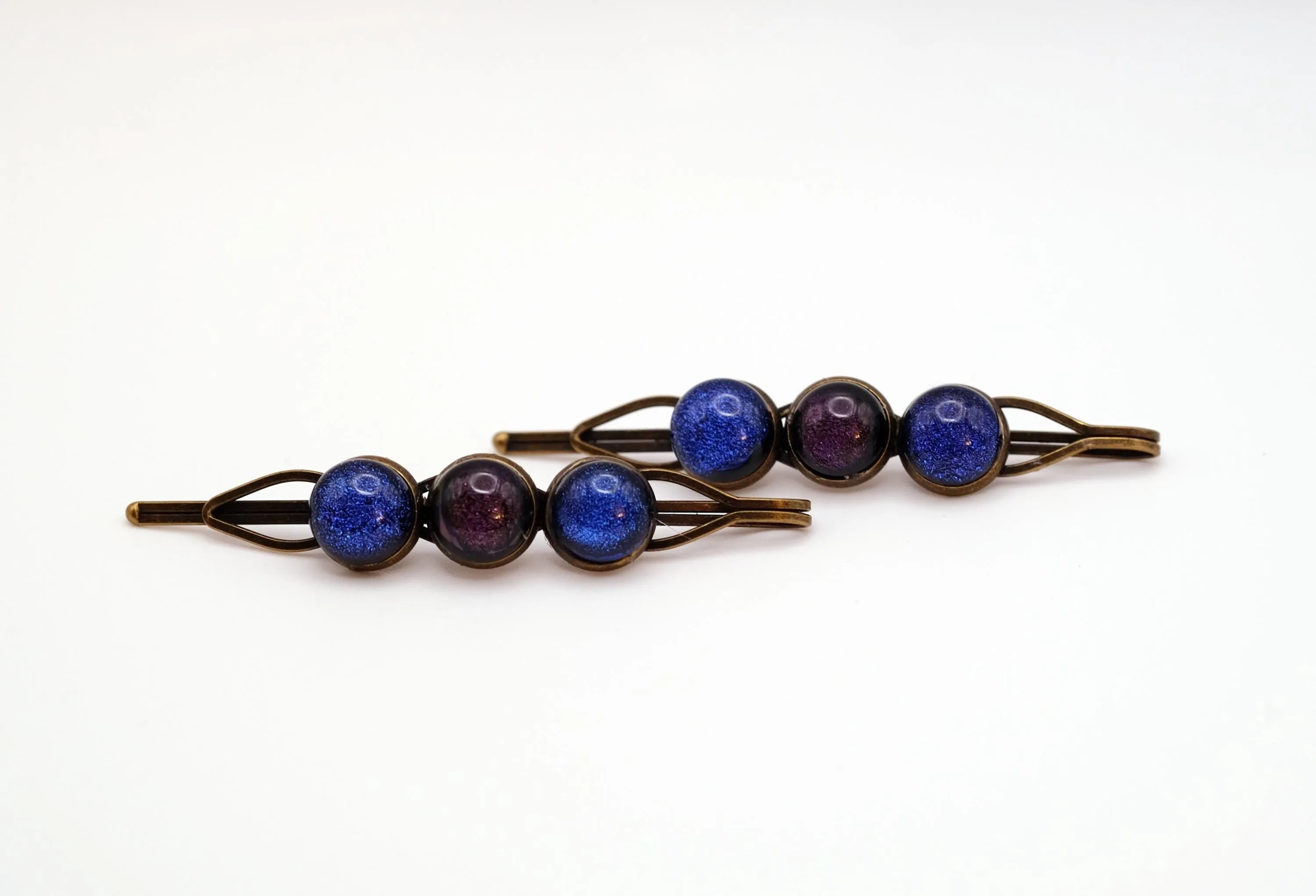 Bronze colored Bobby pin pair with 3 colored fused glass cabochons (shades of Purple & Blue), 3 inches